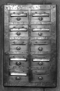 Deserted Post Office Drucke: An old mailbox mounted on a wall