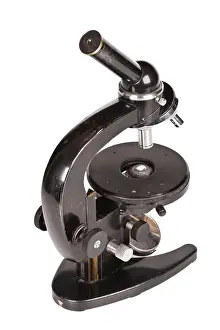 White Background Isolated Drucke: Old microscope isolated on white background