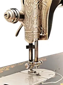 Handicraft Sewing Drucke: Front part of old sewing machine against the white wall