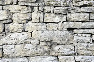Historic Stone Structure Drucke: Old stone wall out of shell limestone