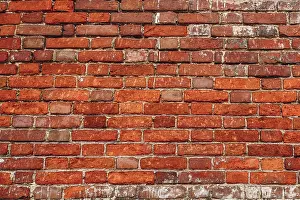 Weathered Brick Wall Drucke: Old wall of red and weathered bricks. Background