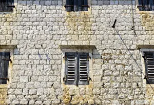 Historic Building Europe Drucke: Old wall and windows closed with shutters