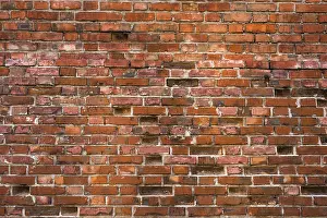Weathered Brick Wall Drucke: Old and weathered brick wall. Background for anything