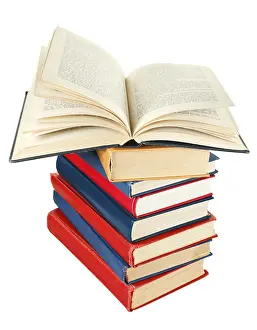 Plain Background Drucke: Open book on top of stack of books isolated on white background