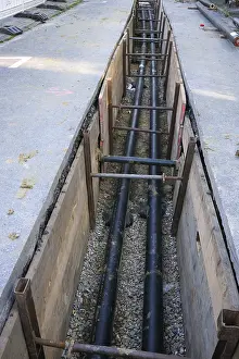 Bilder Datiert 10. März 2024: Open excavation pit pipework construction work infrastructure