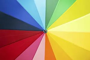 Colourful Deserted Landscape Drucke: Open multicolored umbrella background