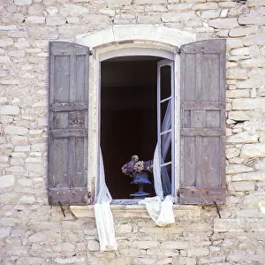 French Architecture Images Drucke: Opened window with shutters in a stone facade