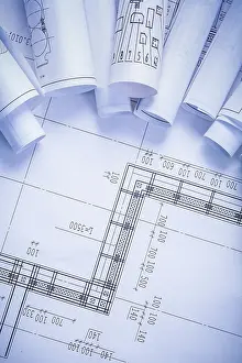 Blueprint Depiction Drucke: Organized copyspace with rolled blueprints