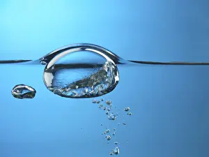 Water Surface Drucke: Oxygen bubble rising to the surface of water