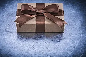Gift Box Drucke: Packed gift boxes with brown ribbon horizontal version holidays concept
