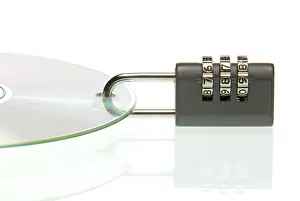 Data Theft Prevention Drucke: Padlock on CD with data, symbolic for data security or password