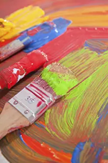 Deserted Studio Scene Drucke: Paintbrushes lying on mixed colours