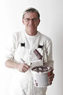 Paint Roller Drucke: Painter with paint roller and bucket