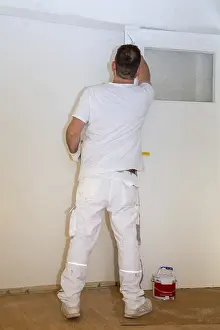 One Person Construction Team Drucke: Painter renovates an old flat