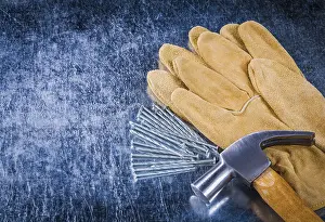 Protective Gloves Drucke: Pair of leather protective gloves construction nails
