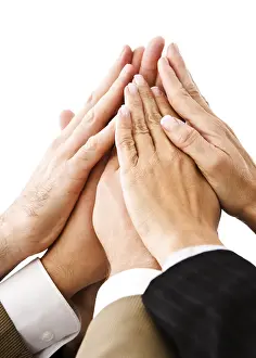 Studio Shot Of Hands Drucke: Four pairs of hands over each other