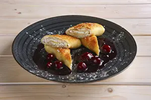Thin Pancakes Drucke: Thin pancakes with curd and cherry jam