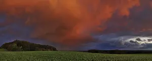 Gloomy Evening Atmosphere Drucke: Panorama of storm clouds in the sunset
