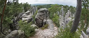 Central European Landscape Photo Drucke: A panoramic view over bizarre rock structures surrounded by forest under a partly cloudy sky
