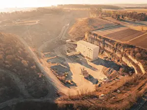 Central Europe Panoramic Views Drucke: Panoramic view of a quarry with surrounding fields at sunrise