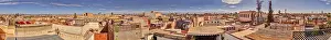 North African Buildings Drucke: Panoramic view of the rooftops of Marrakech in Morocco under a blue sky with some clouds