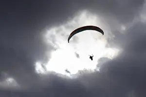 Recreational Activity In Central Europe Drucke: Paraglider in the sky, thunderclouds