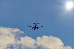 European Air Traffic Scene Drucke: Passenger plane in front of cloudy sky