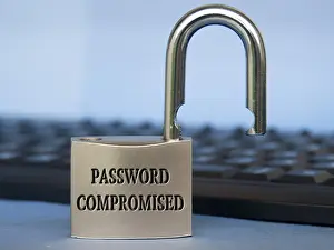 Computer Hacking Crime Drucke: Password compromised text engraved on padlock with blurred keyboard background