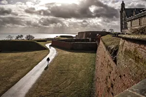 Northern Europe Landmarks Drucke: Pathway through fortification under dramatic skies