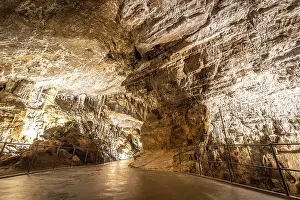 Southeast Europe Landmark Drucke: Pathway winding through illuminated postojna cave