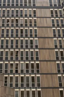 Modernist Architectural Style Drucke: A pattern of windows of an abandoned high rise building