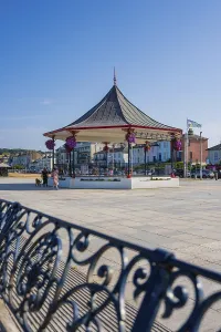 Old Town Square Photography Drucke: A pavilion with decorative elements on a sunny town square