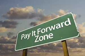 Cloudy Sky Image Drucke: Pay it forward zone green road sign in front of dramatic clouds and sky