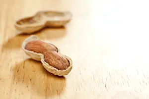 Wood Background Image Drucke: Peanuts on wood background with dramatic lighting
