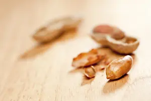 Wood Background Images Drucke: Peanuts on wood background with dramatic lighting