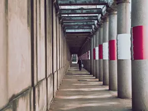 Deserted City Street Scene Drucke: Pedestrian passageway with concrete columns