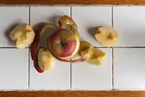 Empty Kitchen Table Scene Drucke: Peeled apple on tile white kitchen table