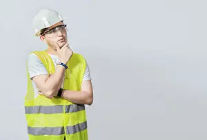 Low Angle View Photography Drucke: A pensive engineer on white background