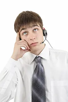 White Background Portrait Drucke: Pensive Young Man in Headset is Thinking