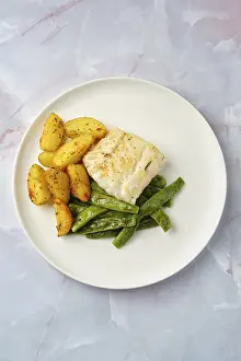 Green Bean Nutrition Drucke: A perfectly cooked cod fillet on a white plate