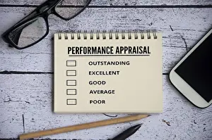 Performance Appraisal Checklist Drucke: Performance appraisal checklist on notepad with with office setting background