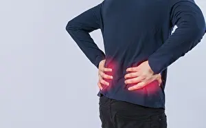 Back Pain Concept Drucke: Person with back problems on isolated background