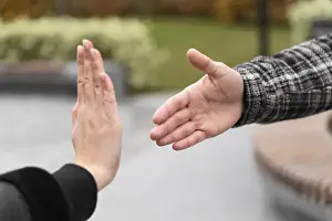 Protection Against Infection Drucke: Person refusing shake hands protection