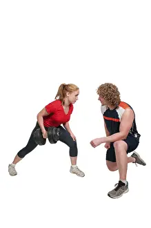 One Person Exercise Routine Drucke: Personal trainer coaching a client as they exercise