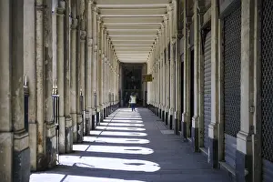 Travel Photography Historic Quarter Drucke: Perspective view of historic colonnade with dramatic sunlight and shadow pattern