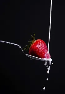 Nutrition Facts Fruit Drucke: A piece of fruit in a spoon milk dropping