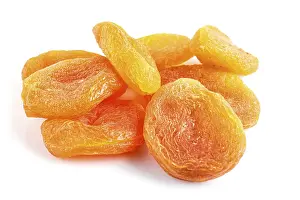 Isolated Fruit Drucke: Pile of dried apricots isolated on white background