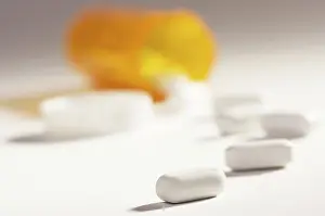 Medical Remedy Drucke: Pills and fallen bottle with dramatic lighting