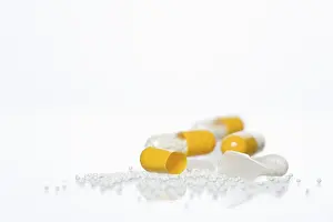 Addictive Drug Abuse Drucke: Pills on a white surface