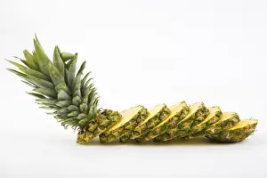 Bright Background Food Images Drucke: Pineapple with slices on a white background